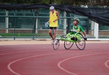 Come Supportare gli Avanzamenti Paralimpici e l’Inclusione man using green wheelchair for walking